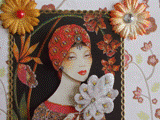 Carte postale 3D femme à l'éventail pailleté en plumes et turban rouge. Dans la rubrique "carnet" vous trouverez un carnet assorti à la carte.